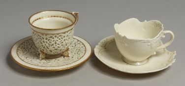 A ROYAL WORCESTER EMPRESS SHAPED TEACUP AND SAUCER with reticulated border moulded with 'C' scrolls.