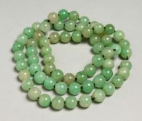 A STRING OF JADE BEADS