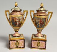A SUPERB SMALL PAIR OF VIENNA URNS, COVERS AND STANDS rich blue gilt decoration and painted