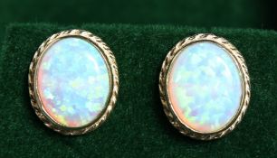 A PAIR OF 9CT GOLD, OPAL STUD EARRINGS.
