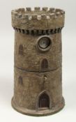 A RARE TURRET PAINTED CIRCULAR TEA CADDY opening halfway to reveal a tea caddy, with a watch in