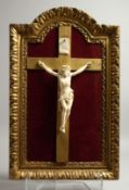 A VERY FINE ITALIAN CARVED IVORY CORPUS CHRISTI. 8ins long in a gilt frame.