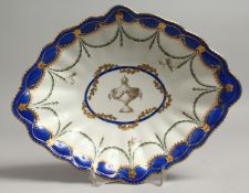 AN 18TH CENTURY CHELSEA DERBY FLUTED LOZENGE SHAPED DISH painted with a central urn with surrounding