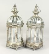 A PAIR OF CIRCULAR SILVERED METAL LANTERNS. 24ins high.