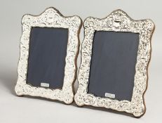 A LARGE PAIR OF SILVER PHOTOGRAPH FRAMES. 19cm x 14cm.
