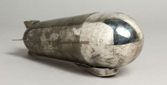 A ZEPPELIN-SHAPED SILVER-PLATED COCKTAIL SHAKER. 9.5ins high.