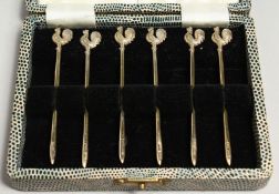 A SET OF SIX SILVER COCKTAIL STICKS by Walker and Hall.