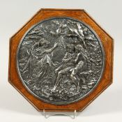 A 19TH CENTURY PLATE OAK FRAMED CLASSICAL PLAQUE. 10ins diameter.