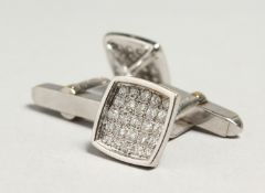 A PAIR OF 18CT WHITE GOLD DIAMOND CUFF LINKS.