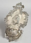 A GERMAN SILVER STOUP with scrolls and Madonna and child. Hanover marks 9.5ins long.