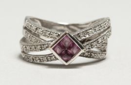 A 9CT WHITE GOLD PINK SAPPHIRE AND DIAMOND RING.