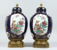 A PAIR OF SAMSON OF PARIS CHINESE DESIGN PORCELAIN JARS AND COVERS, with decorative ormolu finials