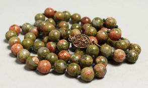 A STRING OF CHINESE BEADS