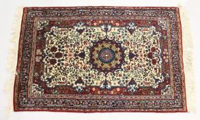 A PERSIAN RUG, cream ground with all over floral decoration. 5ft 6ins x 3ft 7ins