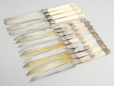 THIRTEEN VARIOUS SILVER HANDLED TEA KNIVES.