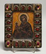 A GOOD SMALL RUSSIAN ICON, MADONNA AND CHILD, the frame inset with semi-precious stones. 7ins x 6ins