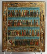 A GOOD RUSSIAN ICON with four rows of saints. 12ins x 10ins