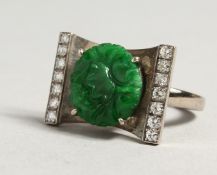 A GOOD PLATINUM JADE AND PEARL RING.