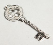 A TIFFANY WHITE GOLD DIAMOND SET KEY. 5cm long in original pouch and box.