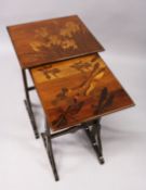 A NEST OF TWO GALLE MARQUETRY TABLES, the larger inlaid with lilies, the smaller with dragonflies.