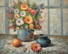 T. Denver (20th Century) A still life of mixed flowers in a vase on a table along with an apple