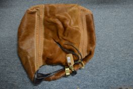 A Jimmy Choo handbag.