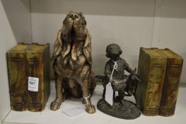 A pair of alabaster book shaped bookends, a spelter figure of a girl and a goat and a model of a
