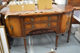 A mahogany sideboard and matching serving table.