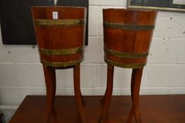 A pair of brass bound jardinieres.