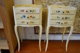 A pair of cream painted three drawer bedside chests.