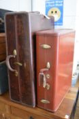 An old Samsonite wardrobe trunk and similar suitcase.