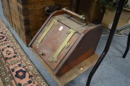 A Victorian walnut and brass coal box.
