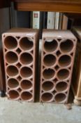 A pair of terracotta wine racks.