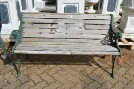 A garden bench with metal ends.