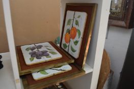 A set of three unusual painted tile pictures.