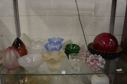 A collection of decorative cut glass and other lampshades.