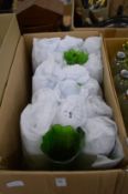 A quantity of green cut glass lampshades.