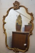 A decorative gilt framed mirror.