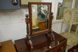 A walnut dressing table mirror.