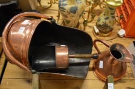 A copper coal scuttle and shovel and a harvest jug.