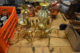 Two brass chandeliers and two table lamps.