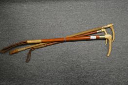 Three riding crops.