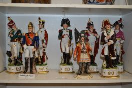 Porcelain military figurines and a pirate king.