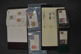 Four stamp albums and contents.