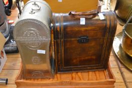 Two wine bottle holders and a decorative tray.