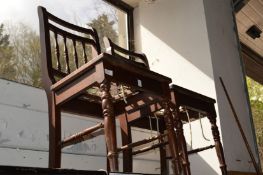 A pair of mahogany chairs.