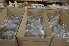 A large quantity of glass lampshades.