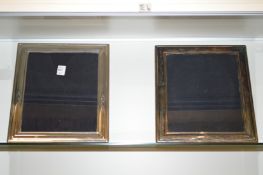 A pair of large silver plated photograph frames.