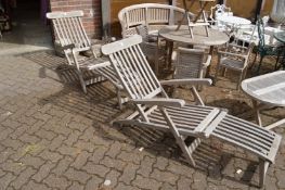 A good pair of teak steamer armchairs.