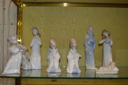 A group of Lladro figurines.